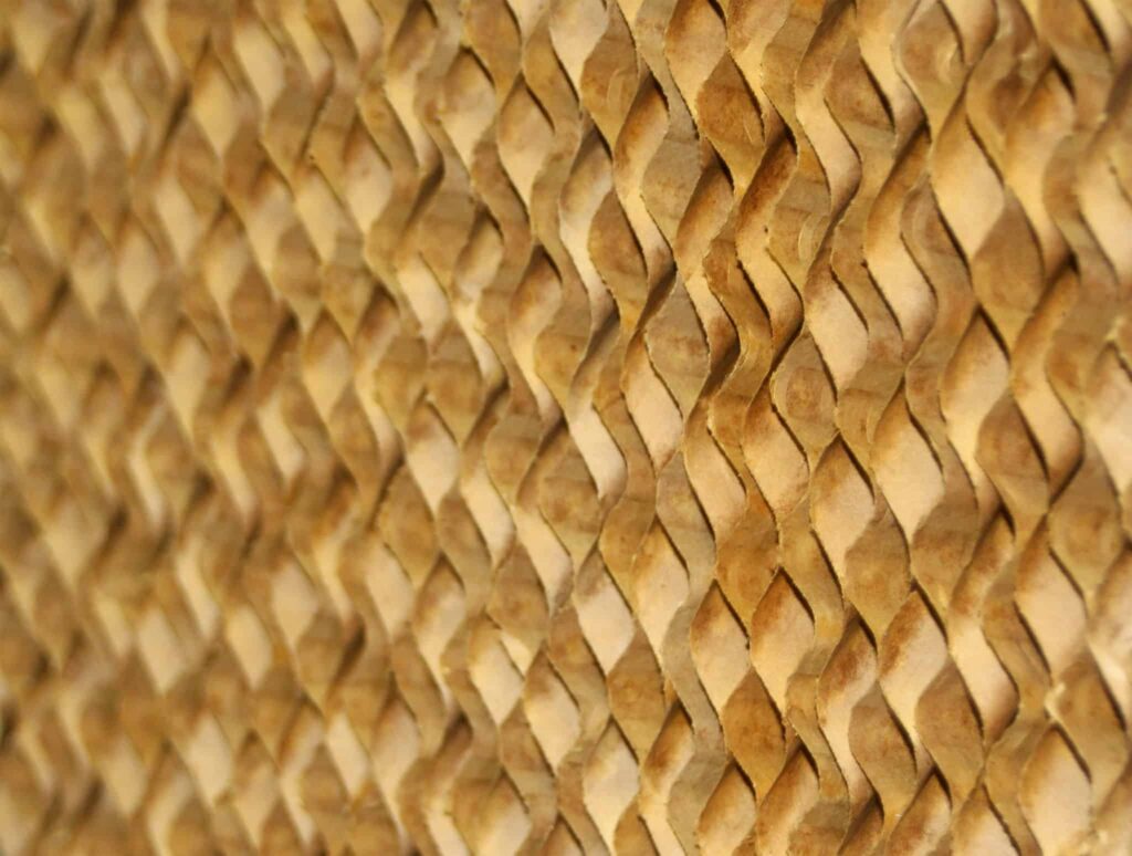 Close-up of a woven diamond pattern with light and dark brown strips, similar to Kuul Evaporative Media, enhancing cooling efficiency.