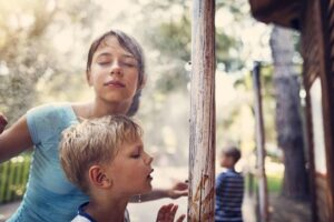 kids using a patio misting system