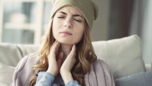 woman with a sore throat caused by air conditioning