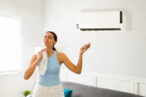 woman overheating when her air conditioning isn't working