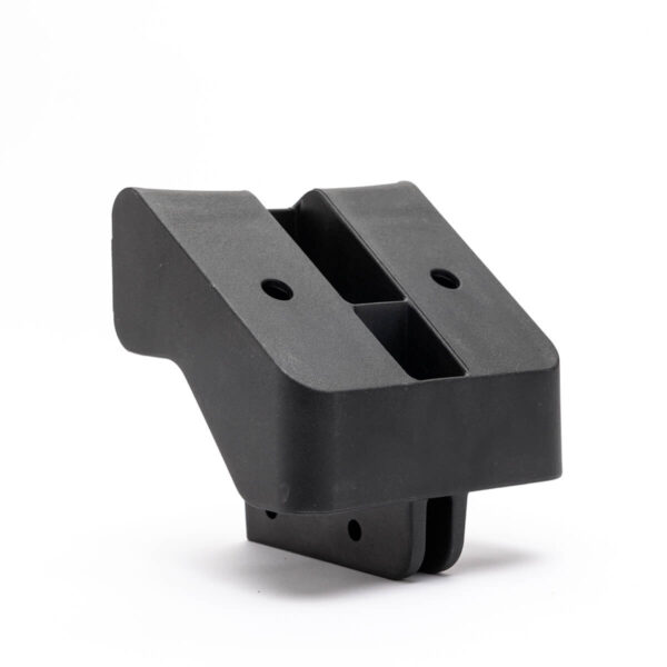 Black L-shaped plastic bracket for Upper Supt Mnt, JS250, 260, APEX™ 4000. Features central groove and flat base. White background.