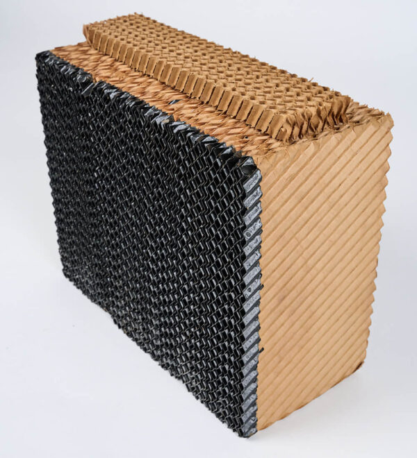 Textured, rectangular block with a honeycomb pattern and black sides. Tan top and front resemble HydroTek Replacement Media Set for APEX 2000. Ideal for industrial use.