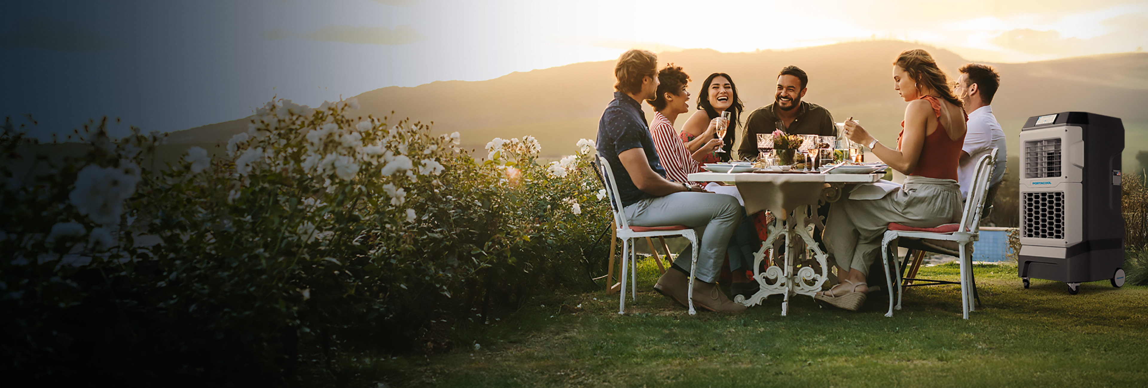 Group enjoys the outdoors in the heat of summer because of the small Portacool on their patio.