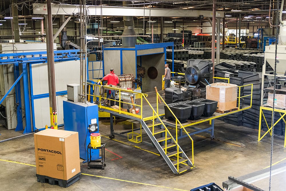 Factory floor showing durable external housing being constructed for portable evaporative air cooling units.