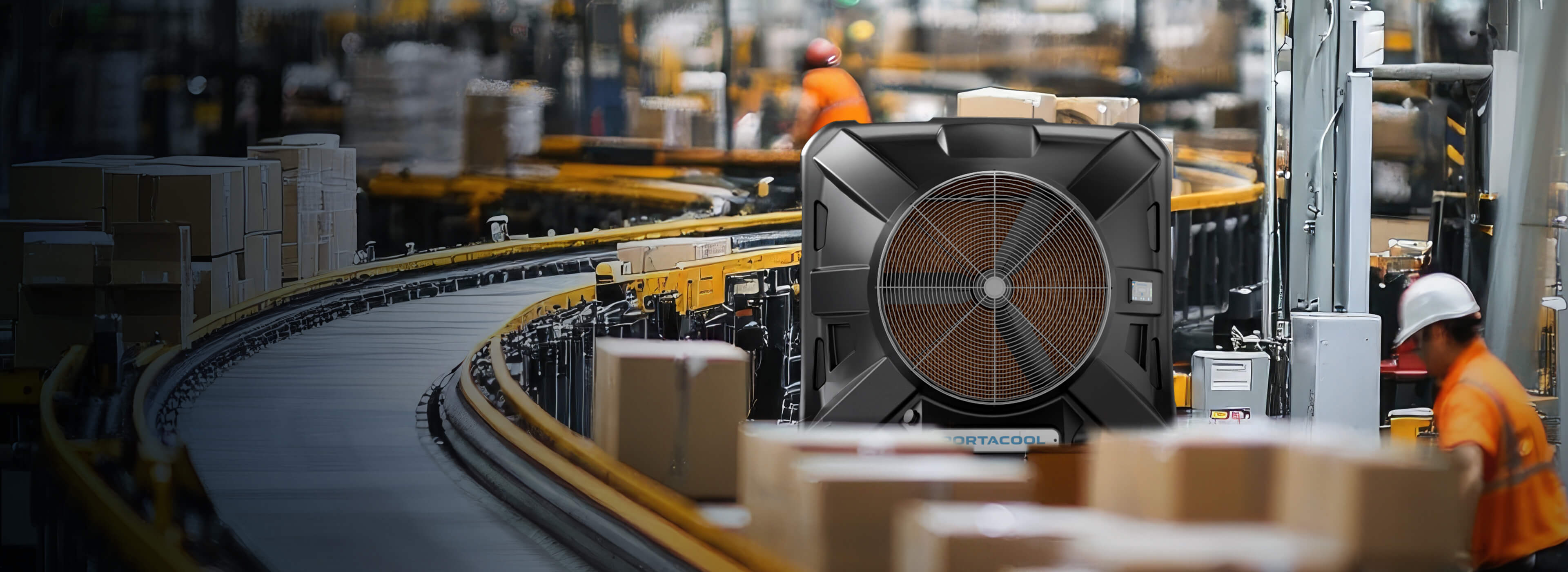 In the bustling warehouse, a large Portacool towers over workers in orange safety vests and helmets sorting packages near active conveyor belts.