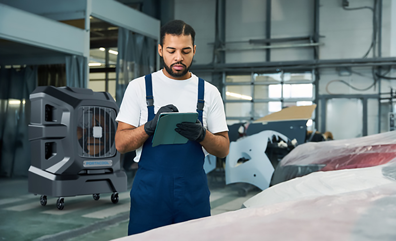 Auto body technician enjoys comfort while working in a huge open garage.